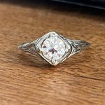 18k vintage setting with 6mm OEC moissanite center