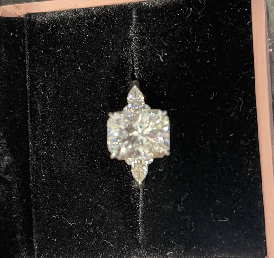 11x8mm Radiant moissanite with round and pear side stones