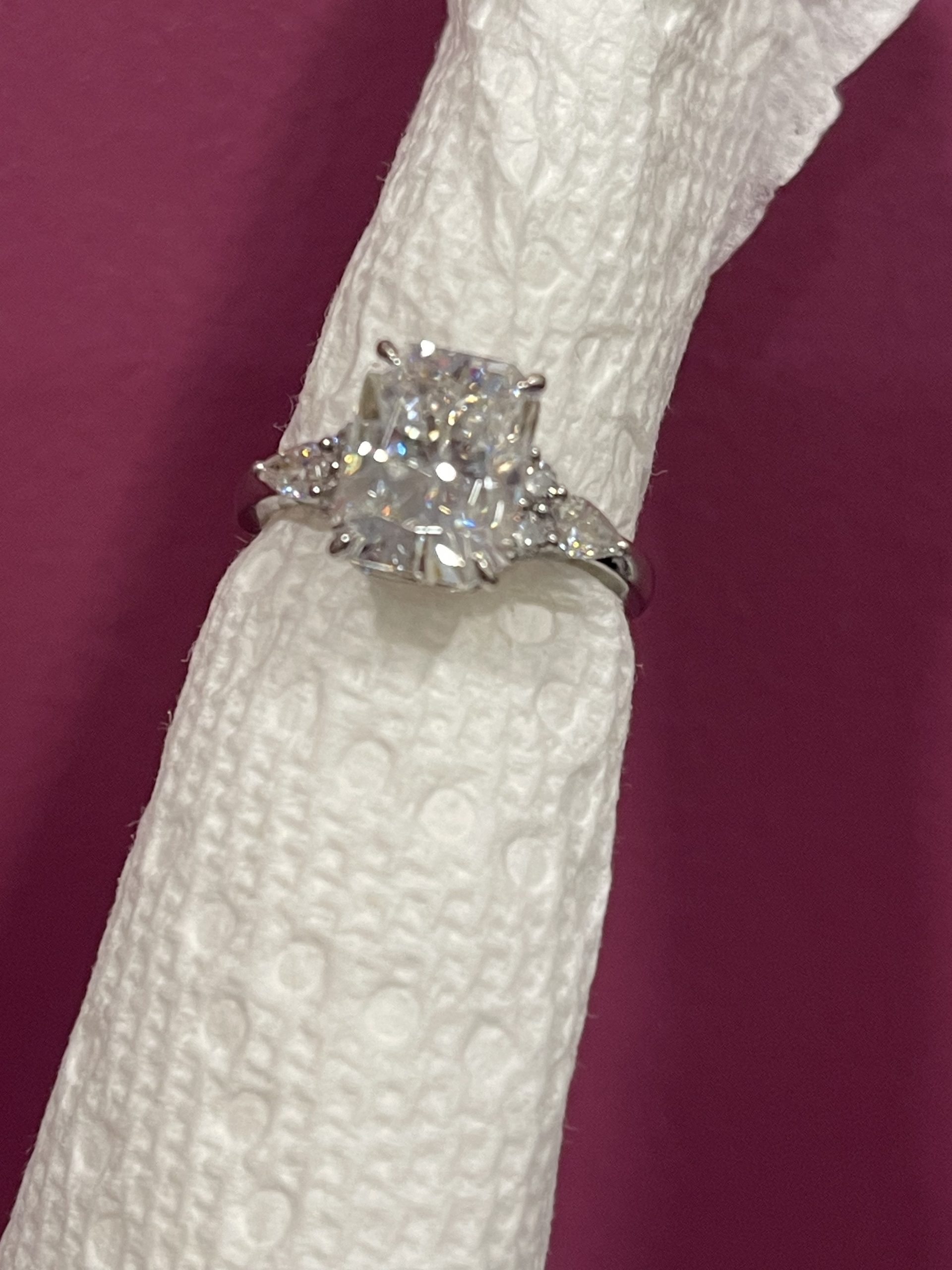 11x8mm Radiant moissanite with round and pear side stones