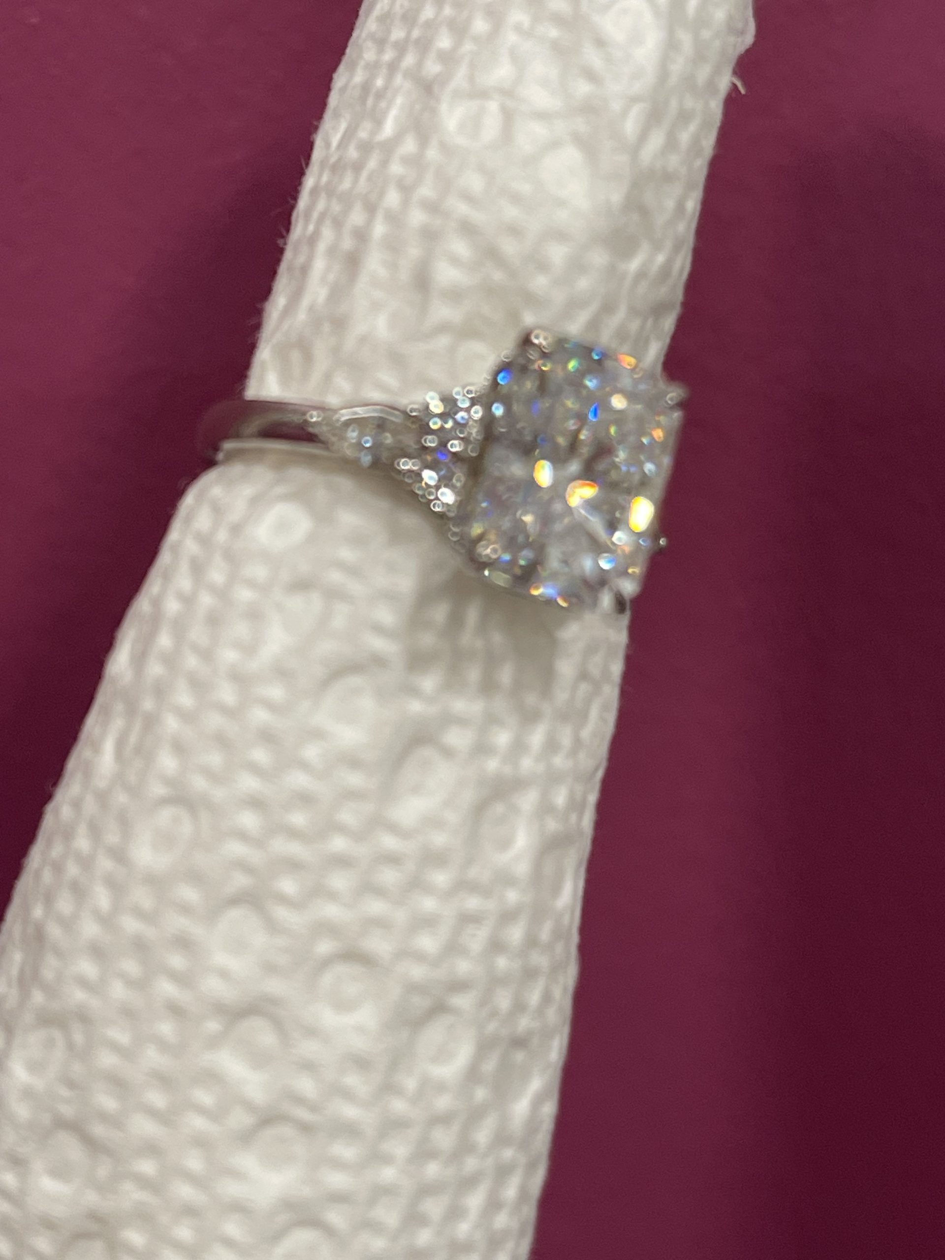 11x8mm Radiant moissanite with round and pear side stones