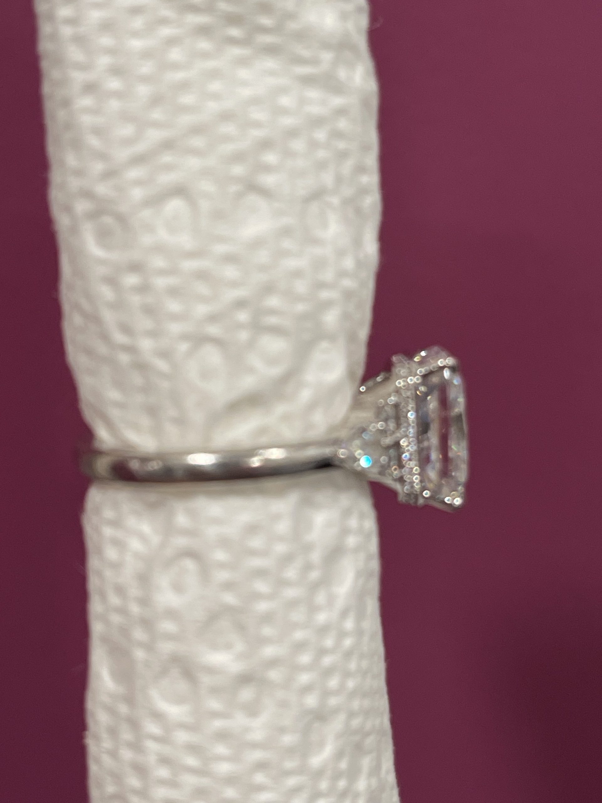 11x8mm Radiant moissanite with round and pear side stones