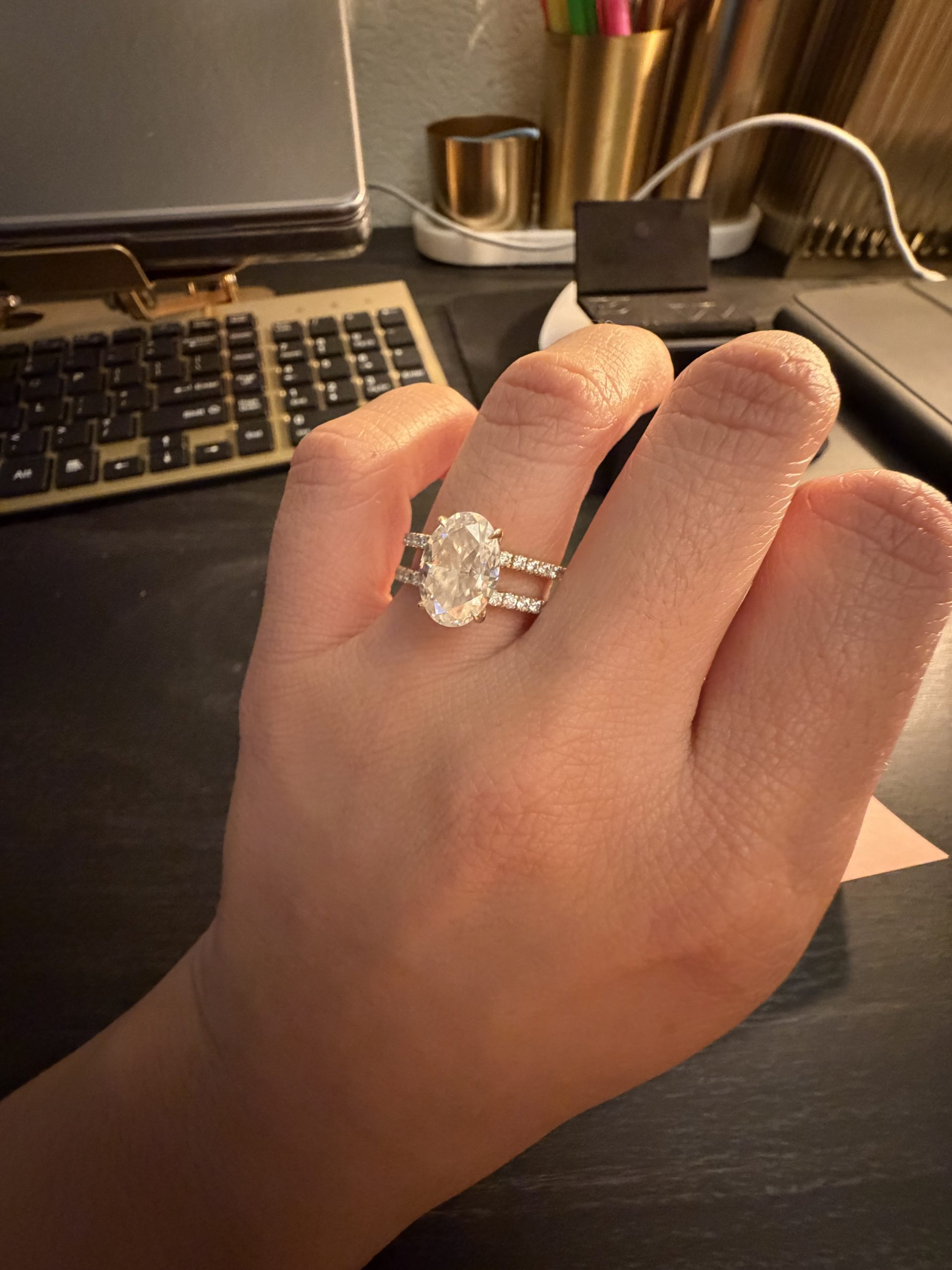 4.1 carat Oval Pavé 1.8mm U-prong pavé bands and an invisible halo