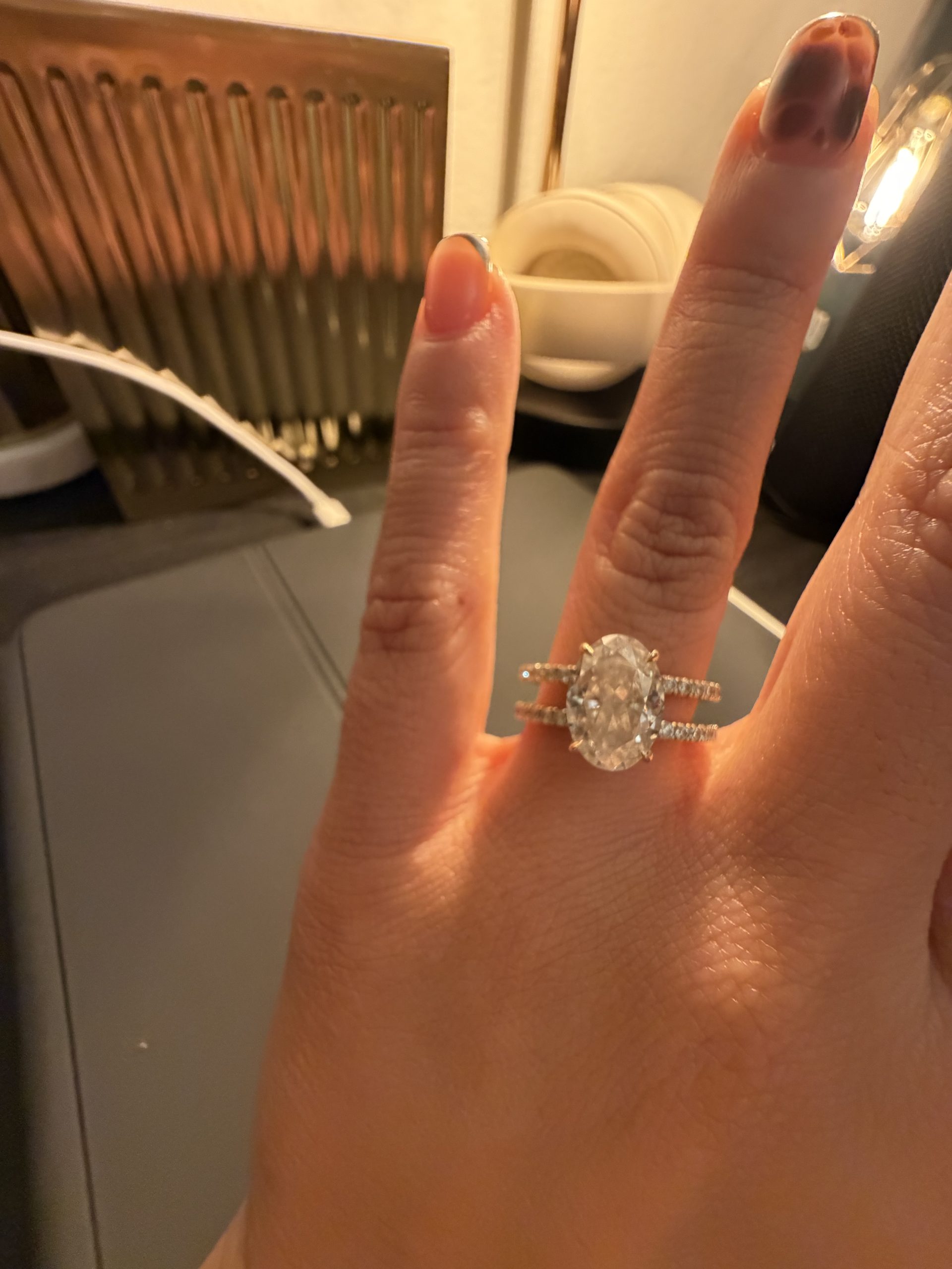 4.1 carat Oval Pavé 1.8mm U-prong pavé bands and an invisible halo