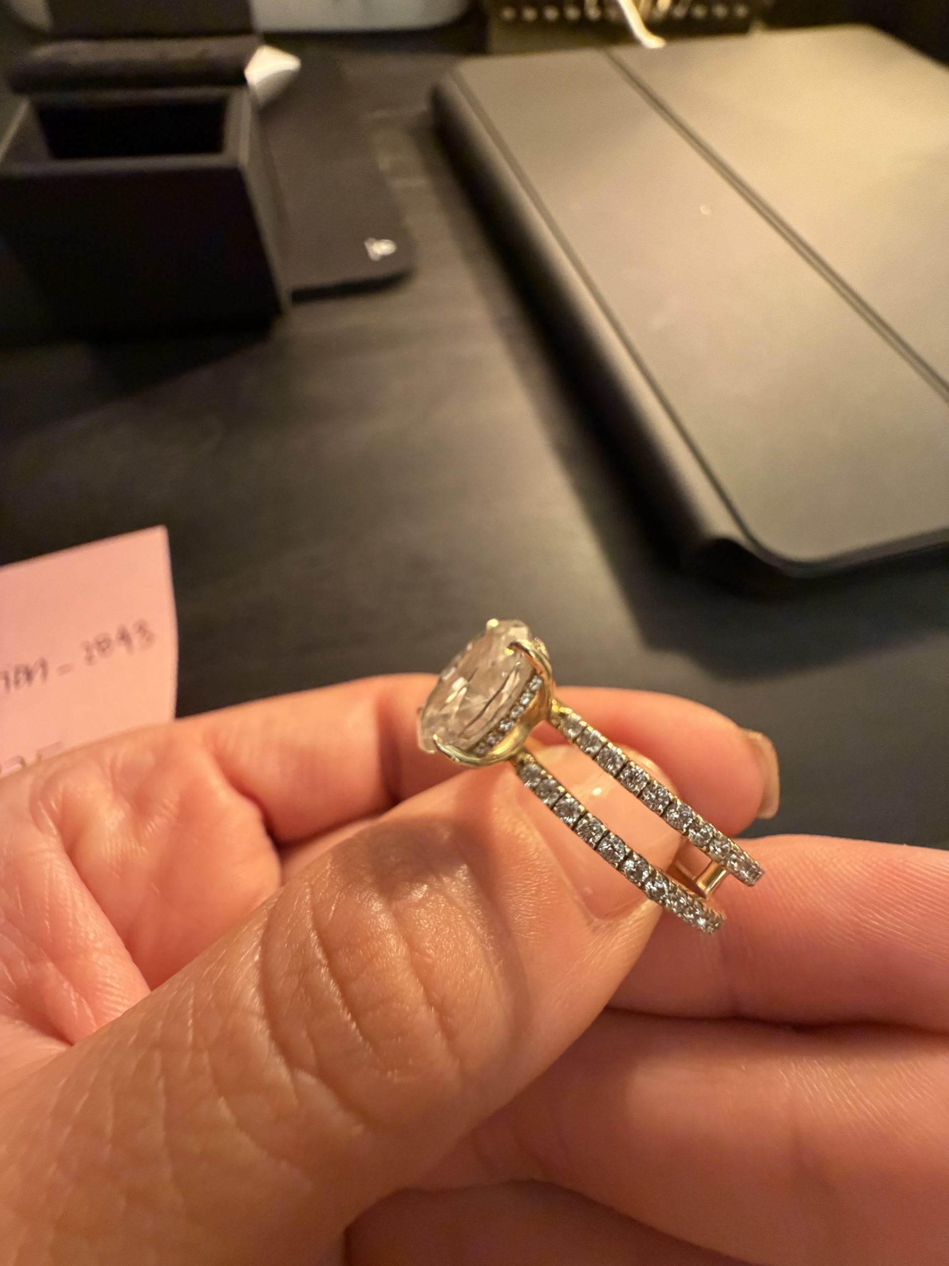 4.1 carat Oval Pavé 1.8mm U-prong pavé bands and an invisible halo